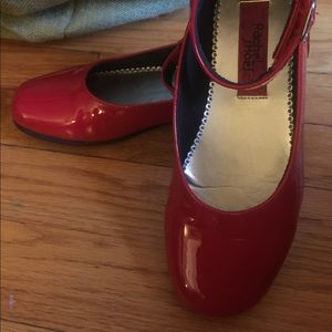 Cute red patent leather shoes.